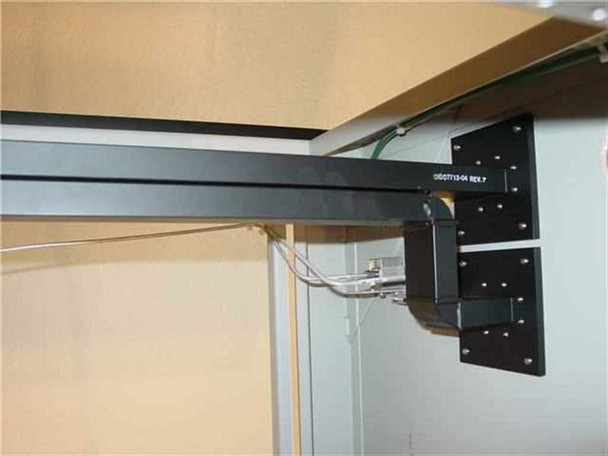 Varian 1007713-04 RF waveguide close-up showing part number label on black rectangular waveguide housing, REV.Y marking visible