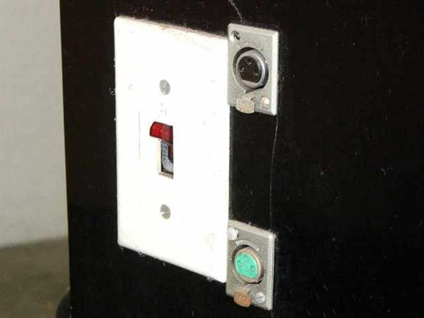 Elicon Ultradrive 600 side panel — power toggle switch with red indicator on wall-plate, flanked by two locking DIN-style connectors (upper and lower)