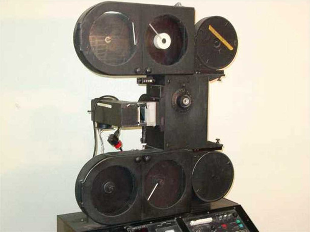 Elicon Ultradrive 600 35mm optical film printer — three-quarter front view showing full film transport column, dual lower film reels, upper single reel, and control console
