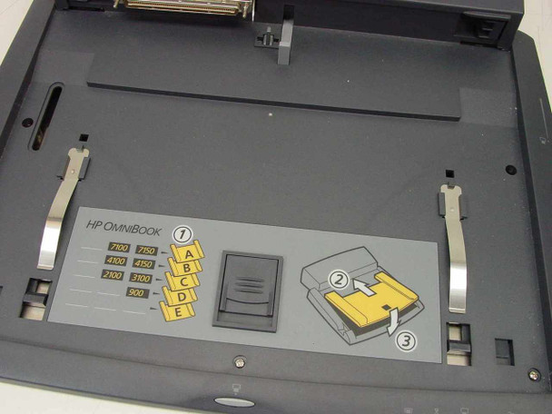 HP F1451A Port Replicator — interior docking platform showing OmniBook compatibility chart with model numbers and insertion diagram