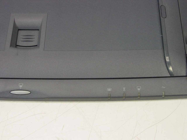 HP F1451A Port Replicator — front edge showing power button, status indicator icons, and eject lever area