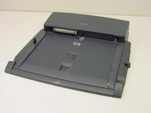 HP F1451A OmniBook 6000 Port Replicator — top and front 3/4 view showing HP logo, laptop cradle surface, docking connector, and side guide rails