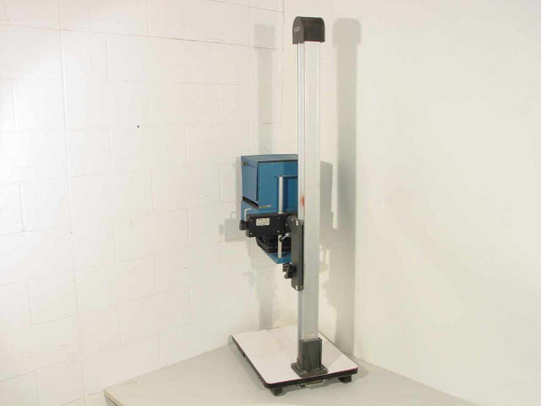 Kenro MP-812 enlarger — side profile view showing aluminum column, camera carriage, and white base platform