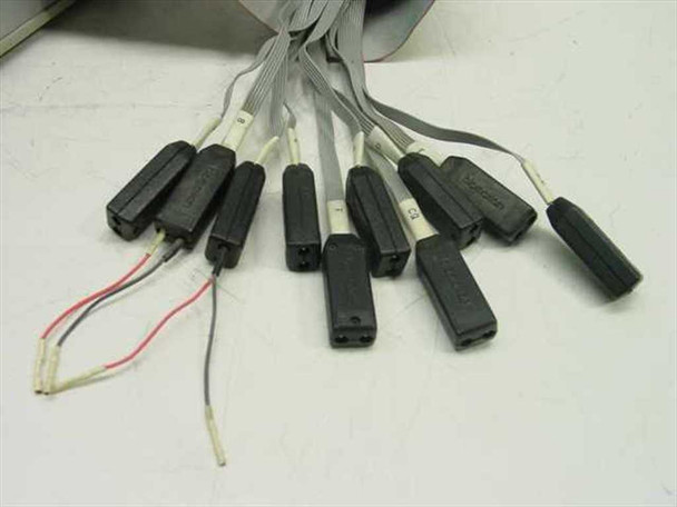 K100D logic analyzer probe set — multiple IC clip-style probe tips on flat ribbon cable with two loose wire leads