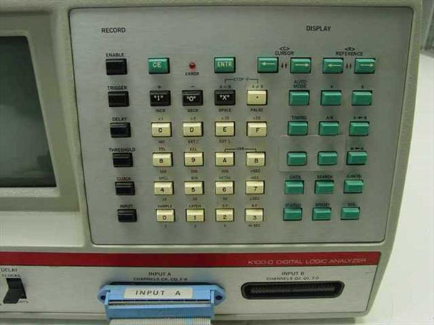 Gould Biomation K100D front keypad close-up showing RECORD and DISPLAY sections, alphanumeric green key array, INPUT A (Ch.0–7) and INPUT B connectors, and K100D Digital Logic Analyzer label