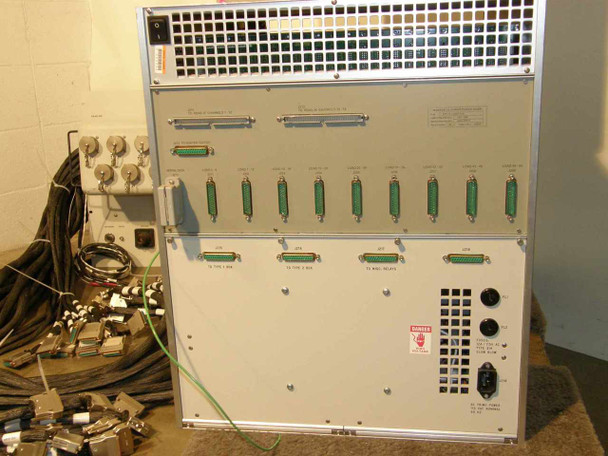 Rear of Maxsys VSX 465 system — upper unit showing D-sub connector rows and relay board, lower unit showing additional D-sub connector rows, IEC power inlet, and HIGH VOLTAGE warning
