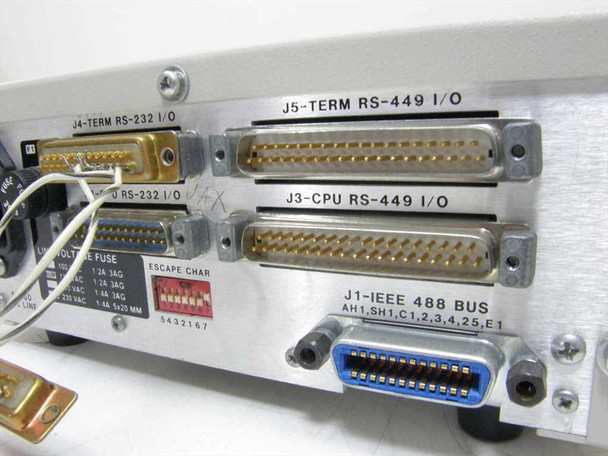 ICS Electronics 4835 rear panel showing all connectors: J4 RS-232, J2 RS-232, J5 RS-449, J3 RS-449, J1 IEEE 488 GPIB, escape character DIP switch, and line voltage fuse label