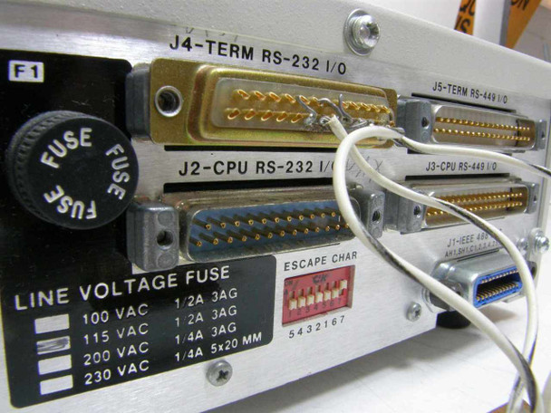 ICS Electronics 4835 rear panel fuse and line voltage label close-up showing 100/115/200/230 VAC fuse ratings and escape character DIP switch block