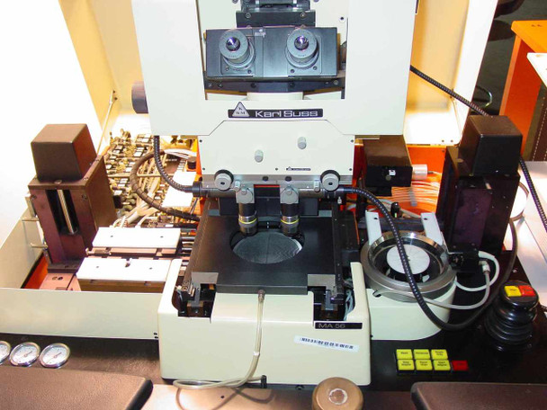 Karl Suss MA56 alignment head close-up — binocular microscope, dual objectives, and wafer chuck with MA56 label visible
