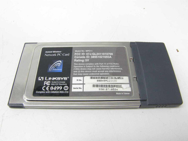 Linksys WPC11 PCMCIA Network Card — rear label showing model number, FCC ID, Canada ID, 5V rating, serial number, and Made in Taiwan markings