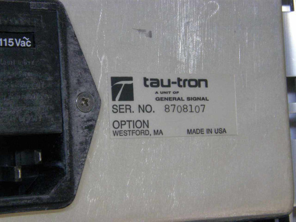 Tau-Tron STX-1101 side/bottom label showing 'tau-tron a unit of General Signal', serial number 8708107, Option field, Westford MA, Made in USA