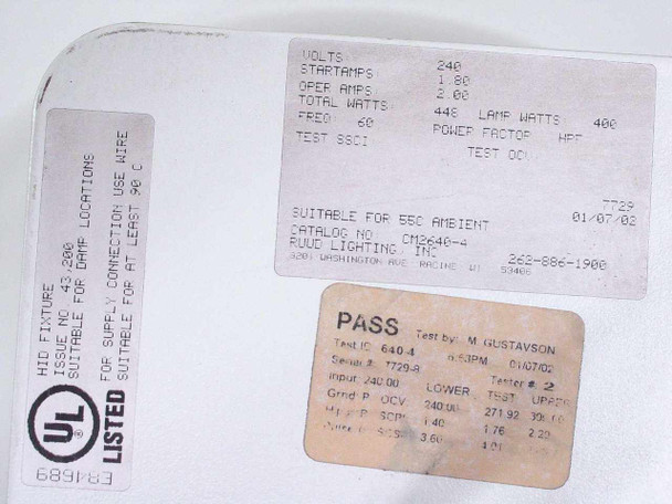 Ruud Lighting ICM2640 rating plate showing 240V, 400W lamp watts, 448W total watts, UL Listed label, and PASS test sticker dated 01/07/02 with catalog number CM2640-4
