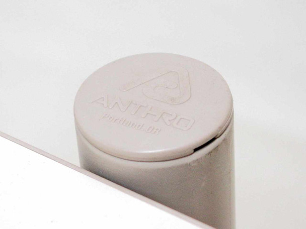 Anthro brand logo embossed on gray plastic post cap reading Anthro Portland OR