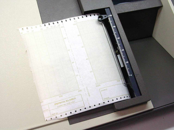 Perkin-Elmer 1430 integrated chart plotter close-up showing Perkin-Elmer branded chart paper loaded, tractor feed mechanism, and ruler scale; no pen present