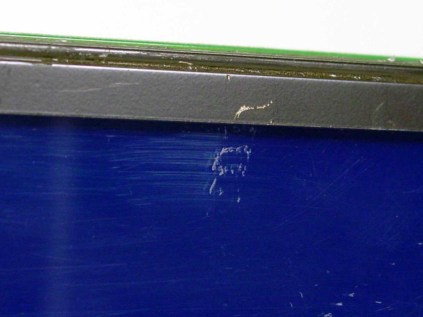 MTB-135 LCD display module — close-up of scratched blue screen surface showing multiple surface scratches and scuff marks