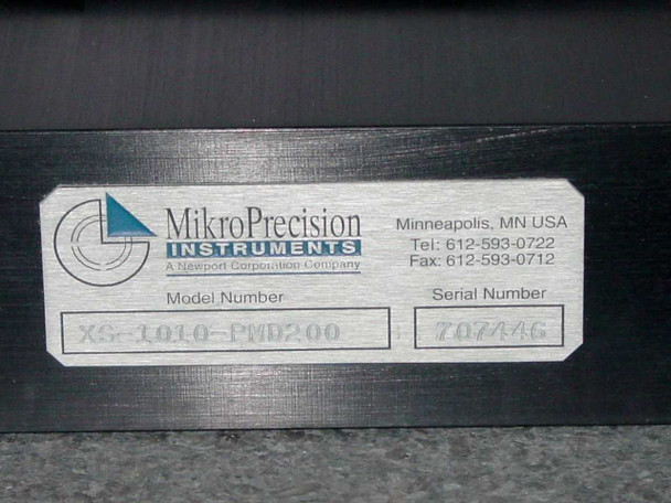 MikroPrecision Instruments label on motion stage — model XS-1010-PMD200, serial number 707446, Newport Corporation company, Minneapolis MN USA
