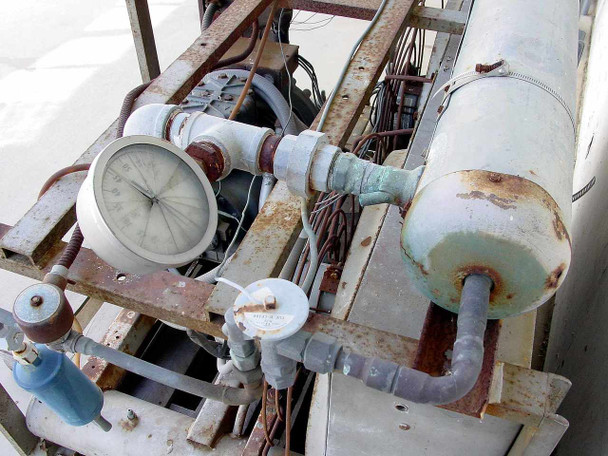 Copeland C2AH0750IFC001 condensing unit top-down view showing pressure gauge, refrigerant receiver vessel, and interconnecting piping