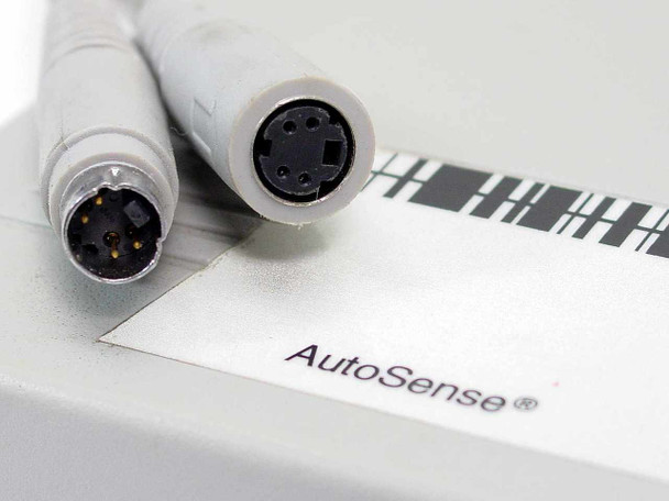 AutoSense base close-up showing dual Mini-DIN connector ports and AutoSense branding on the interface base unit
