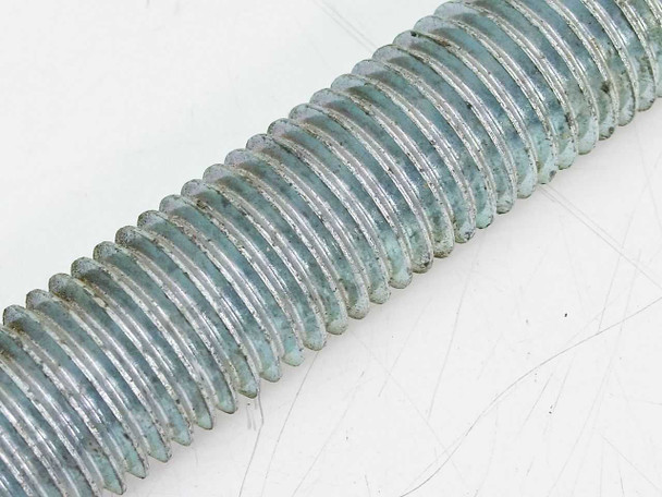 Close-up of galvanized all-thread rod mid-section showing coarse 7 TPI thread detail and zinc galvanized finish