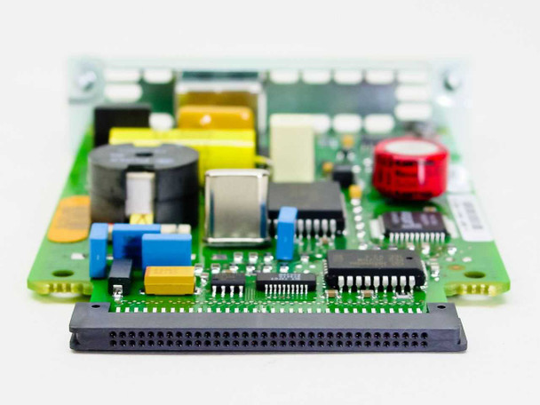 Cisco WIC-1B-U PCB detail showing main controller ICs, capacitors, and WIC edge connector