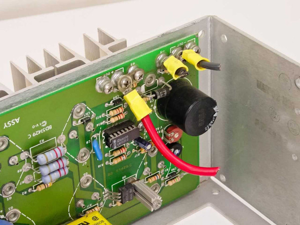 Power-One F24-12-A PCB close-up showing output regulation circuitry, resistors, and wiring harness