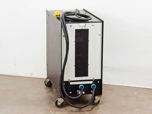Energy Research Associates PPS 8205 MF Plasma Power Supply – left-rear three-quarter view showing high-voltage warning label and output cable connections
