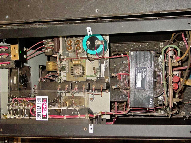 Internal chassis view – upper section opposite side showing toroidal inductor, transformer assemblies, black finned heat sink module, and wiring harness