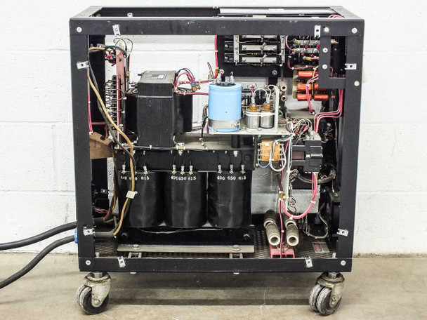ERA PPS 8205 MF internal chassis – full open view from below showing three large black oil-filled capacitors, transformer, and power components on caster base