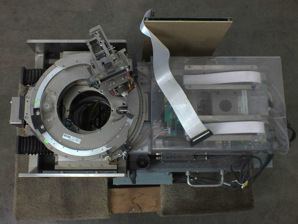 Guzik S1701 Spinstand — overhead top-down view showing spindle ring, head positioning arm, ribbon cable harness, and plexiglass enclosure panels