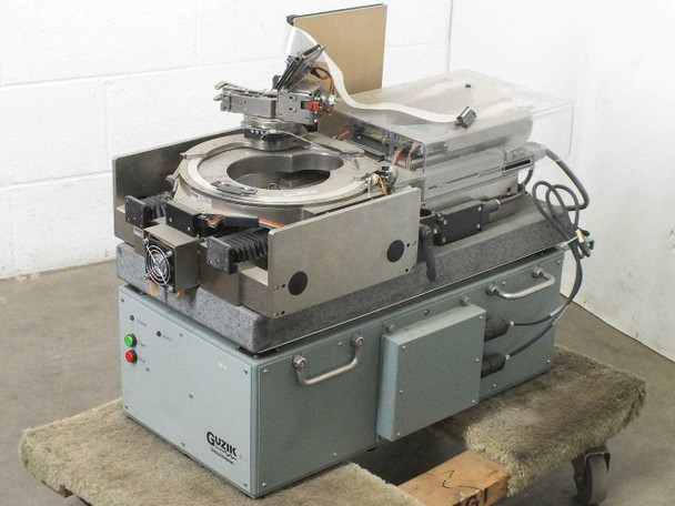 Guzik S1701 HDD Spinstand Component Testing System — front three-quarter view showing full assembly on granite base with enclosure cover and control panel