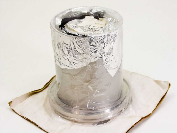 MDC Vacuum 820001 L400-1 LF Clamp wrapped in foil protective packaging, top view