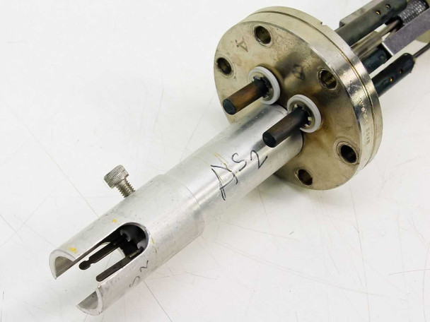 Varian 981-4314 sputtering gun feedthrough — close-up of forked wafer holder tip and circular flange with feedthrough pins