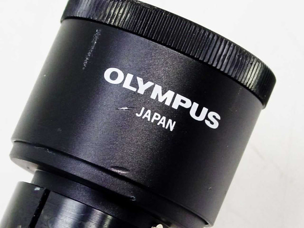 Olympus Japan eyepiece close-up showing 'OLYMPUS JAPAN' branding on the barrel of the WHK eyepiece