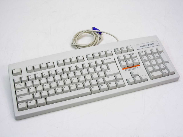 Packard Bell 5140M full-size PS/2 wired keyboard — top view showing full key layout and coiled PS/2 cable