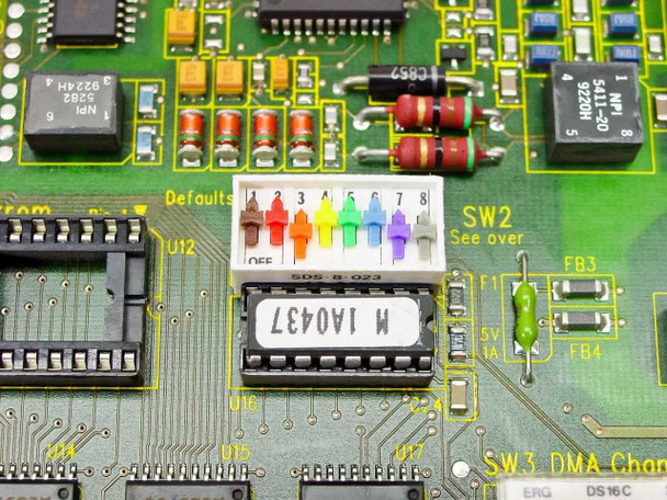 Close-up of DIP switch SW2 and SW3 DMA channel area with Defaults label and SDS B 023 chip on the Madge ringnode card