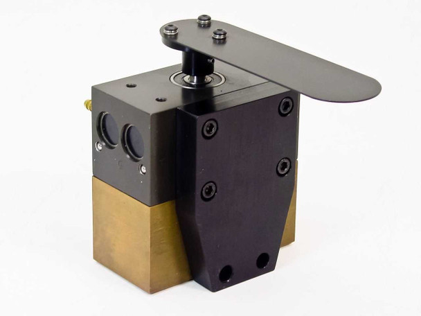 PHD Inc 0180502-3-02 pneumatic actuator assembly — 3/4 front-left view showing black anodized aluminum upper body, brass lower body, and rotary platter on top