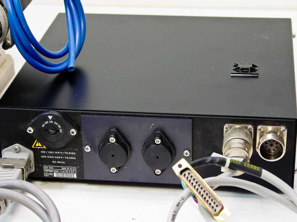 Heidenhain EXE 702B rear panel showing circular multi-pin connectors, DB25 connector, and power input with voltage selector label