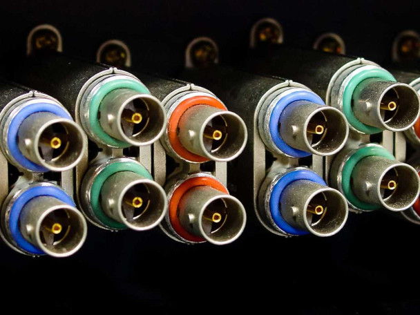 ADC CV-8-N rear BNC connector detail showing color-coded connectors — blue, green, red, and orange — for RGB component video signal routing
