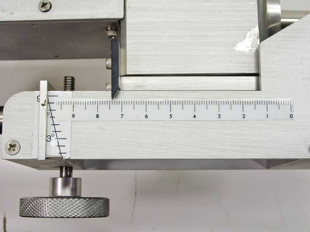 PGT OS19-PO13 XY stage – close-up of machined aluminum linear positioning stage with engraved ruler scale and knurled thumb-screw adjustment knob