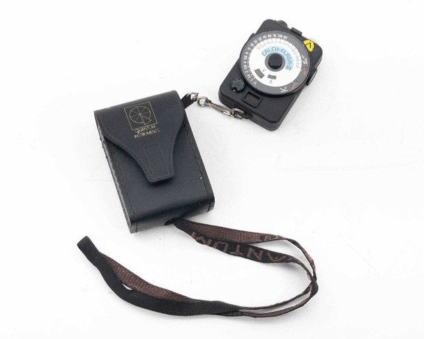 Quantum Instruments CalcuFlash 2 Digital Flash Meter with leather case and neck strap, full set view on white background