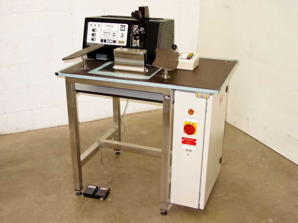 HyBond 616-12 Ultrasonic Peg Bonder full system view with stainless steel work table, X-Y stage, bonder head, and foot pedals on floor