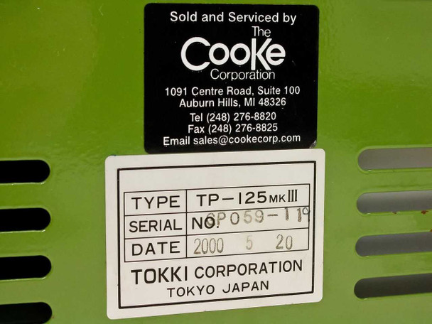Cooke Corporation and Tokki Corporation identification labels showing serial number and manufacture date 2000-05-20