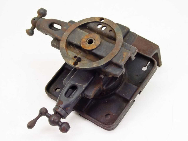 Unbranded manual X/Y cross slide stage – angled top-front view showing round dial, cross knobs, and surface rust on base plate