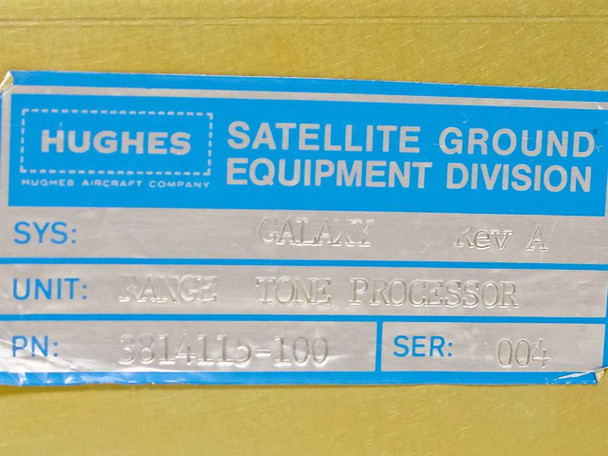 Hughes Aircraft Satellite Ground Equipment Division label close-up showing SYS: Galaxy Rev A, UNIT: Range Tone Processor, PN: 3814115-100, SER: 004