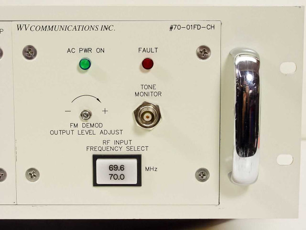 Close-up of WV Communications 70-01FD-CH RF/IF Demodulator module front panel showing AC PWR ON and FAULT LEDs, FM Demod Output Level Adjust, Tone Monitor BNC, and RF Input Frequency Select switch at 69.6/70.0 MHz