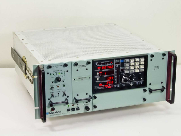 Microdyne 1400-MR Telemetry Receiver front three-quarter view showing full rack chassis with red LED displays lit and multiple module panels