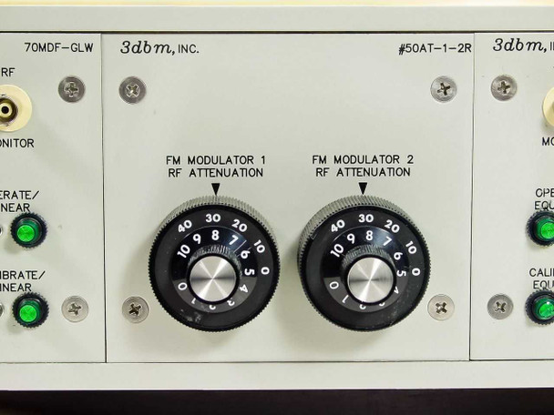 Center section of 3dbm chassis showing 50AT-1-2R dual attenuator plug-in with two rotary RF attenuation knobs labeled FM Modulator 1 and FM Modulator 2 RF Attenuation