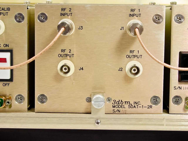 Rear panel of 3dbm 50AT-1-2R dual attenuator plug-in showing RF 1 Input J1, RF 1 Output J2, RF 2 Input J3, RF 2 Output J4 BNC connectors and 3dbm model label