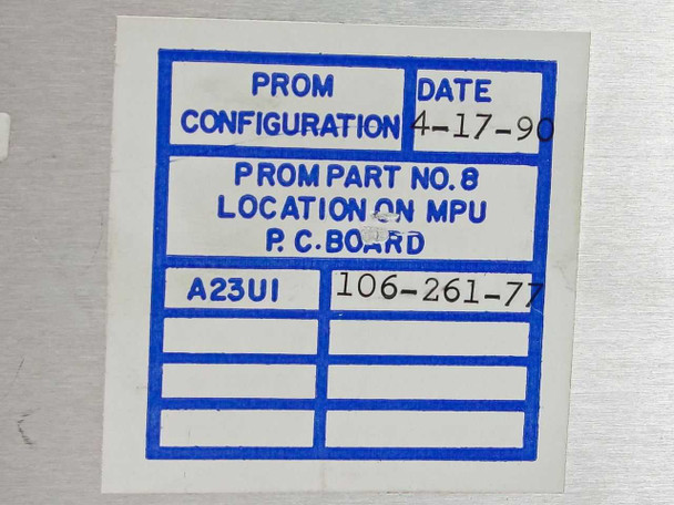 Microdyne 1400-MR PROM configuration label showing PROM part number 106-261-77, location on MPU PC board, configuration A23U1, dated 4-17-90