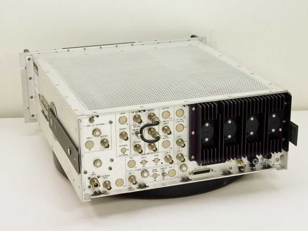 Microdyne 1400-MR rear panel top view showing BNC output connectors, plug-in cards, and heatsink section
